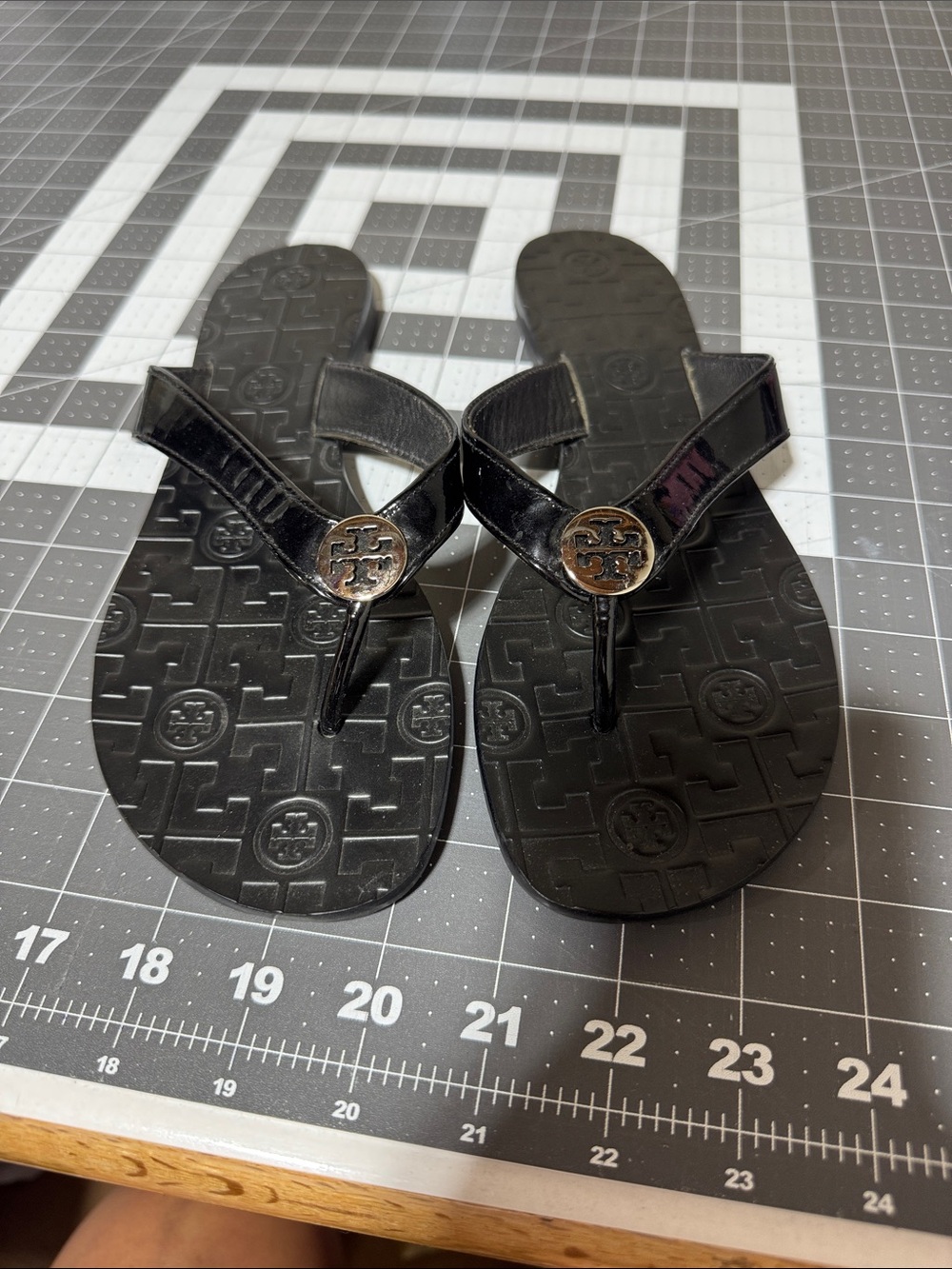 Tory Burch Black Patent Logo Thong Sandals with Silver Medallions